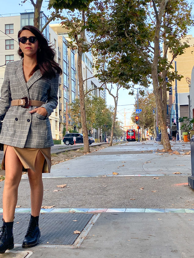 Girl walking with purse in hand in san Diego california 