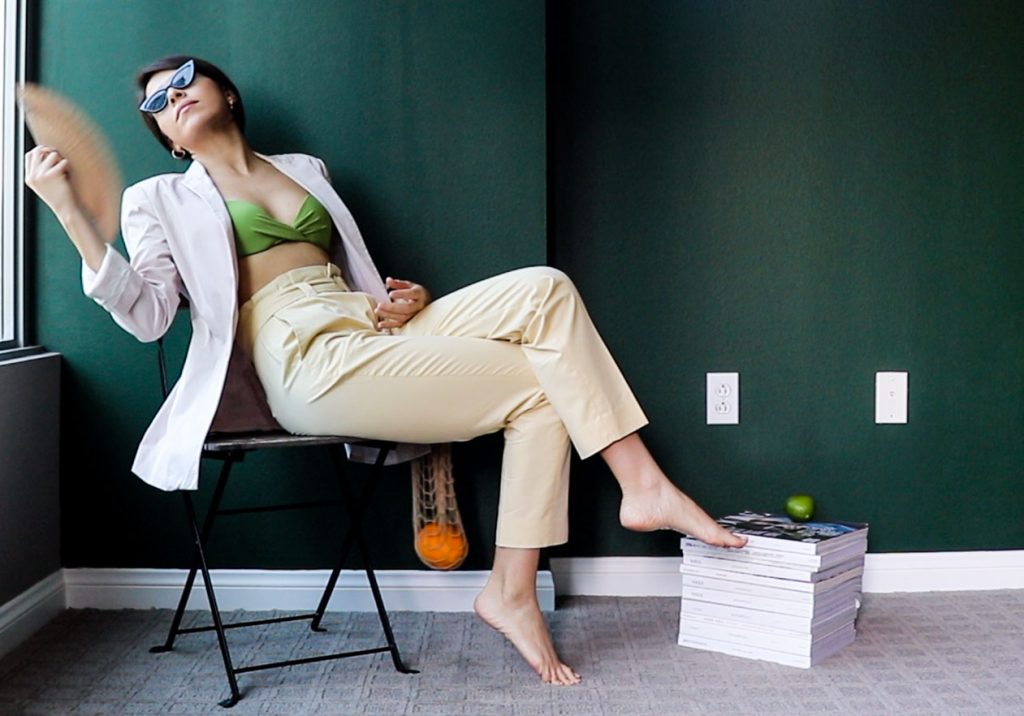 wearing blazer and green top